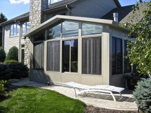 Picture of a beautiful sunroom installed in a backyard.