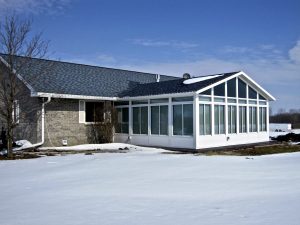 Wisconsin home with insulated sunroom during winter.